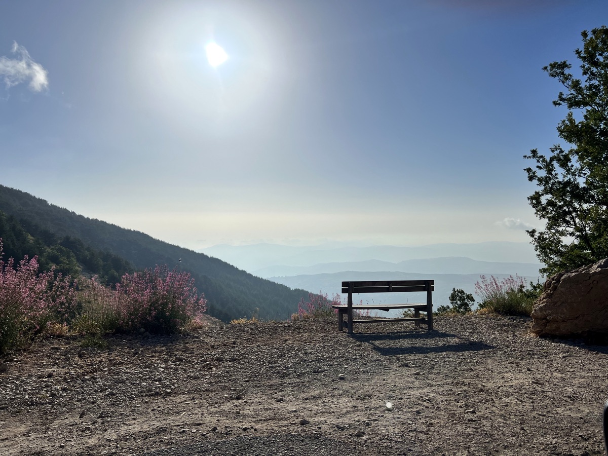 Mountain viewpoint with a bench looking across the Lebanese landscape