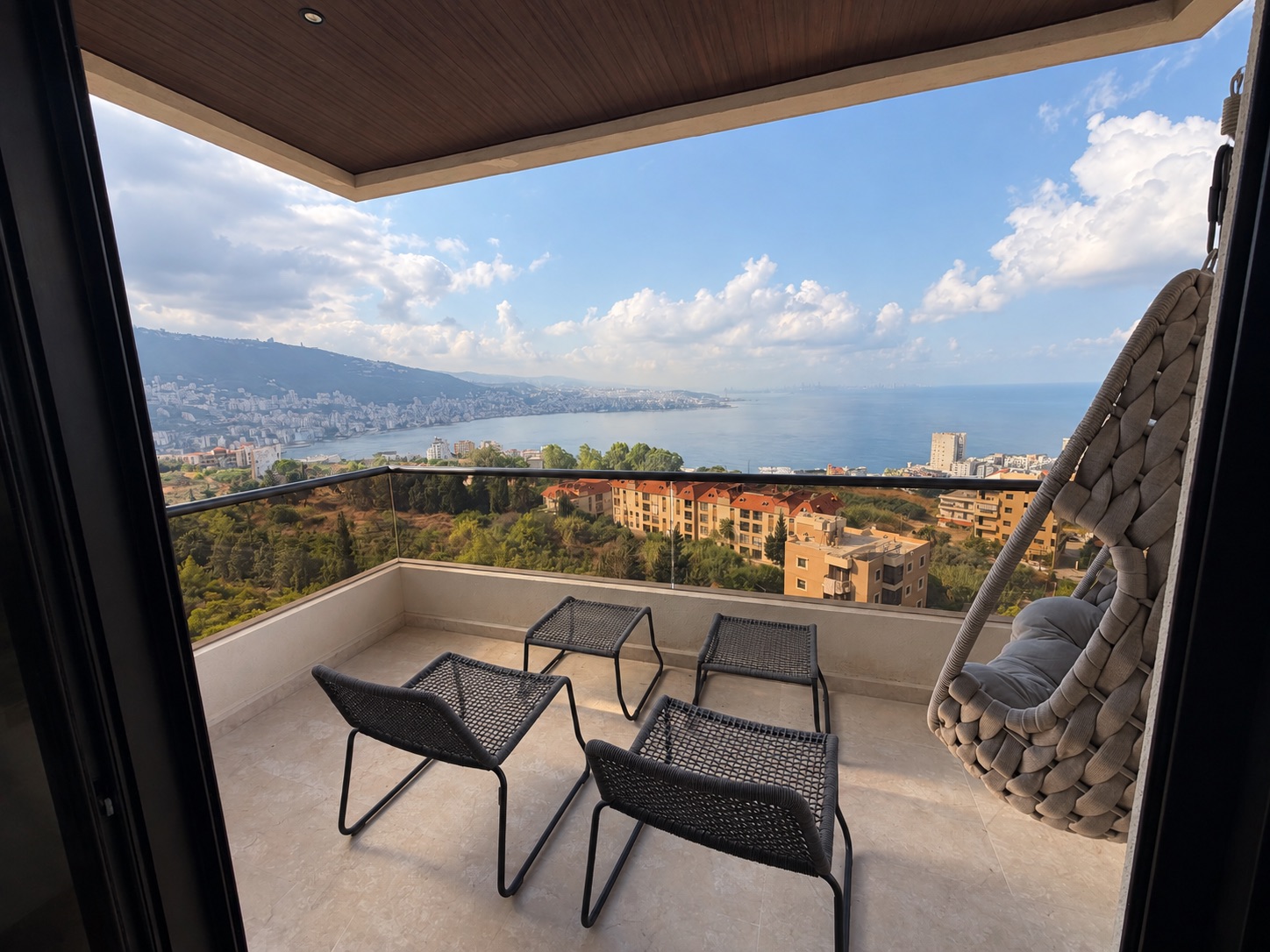 Balcony lounge seating overlooking Jounieh Bay
